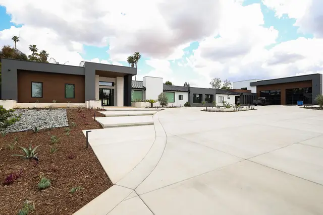Front of a 10,308 sq ft modern custom home in Riverside